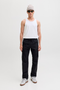 Front image of a model wearing the Jack and jones basic tanktop in white, by brand Jack&jones