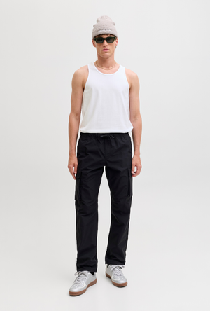 Front image of a model wearing the Jack and jones basic tanktop in white, by brand Jack&jones
