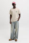 Front image of a model wearing the Brewy ss tee in beige, by brand Jack&jones