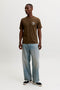 Front image of a model wearing the Brewy ss tee in chocolate, by brand Jack&jones