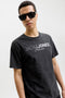 Front image of a model wearing the Blaneo ss tee in black, by brand Jack&jones