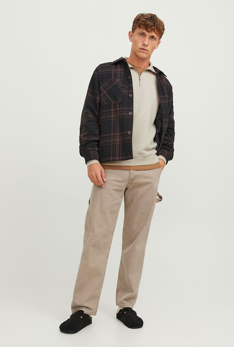Front image of a model wearing Bradley sweat half zip sweatshirt in beige, by brand Jack&jones
