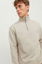 Front image of a model wearing the Bradley sweat half zip sweatshirt in beige, by brand Jack&jones