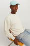 Front image of a model wearing the Jack and jones charge sweatshirt in beige, by brand Jack&jones