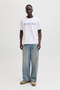 Front image of a model wearing Jack and jones daytona print tee in white, by brand Jack&jones