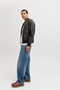 Side image of a model wearing the Jack and jones eddie original jeans in , by brand Jack&jones