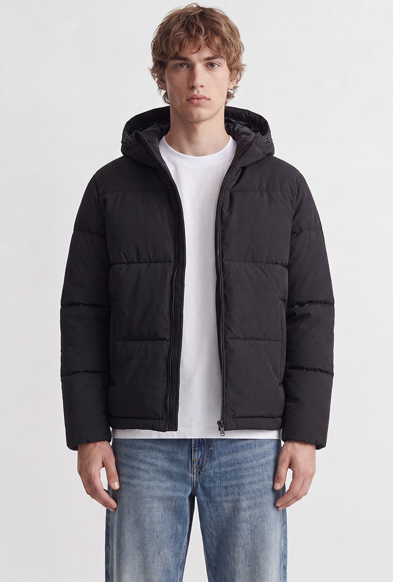 Front image of a model wearing Galaxy puffer jacket in black, by brand Jack&jones