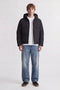 Front image of a model wearing the Galaxy puffer jacket in black, by brand Jack&jones