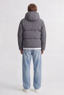 Back image of a model wearing the Galaxy puffer jacket in charcoal, by brand Jack&jones