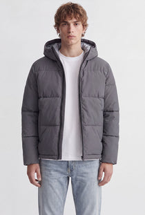 Front image of a model wearing the Galaxy puffer jacket in charcoal, by brand Jack&jones