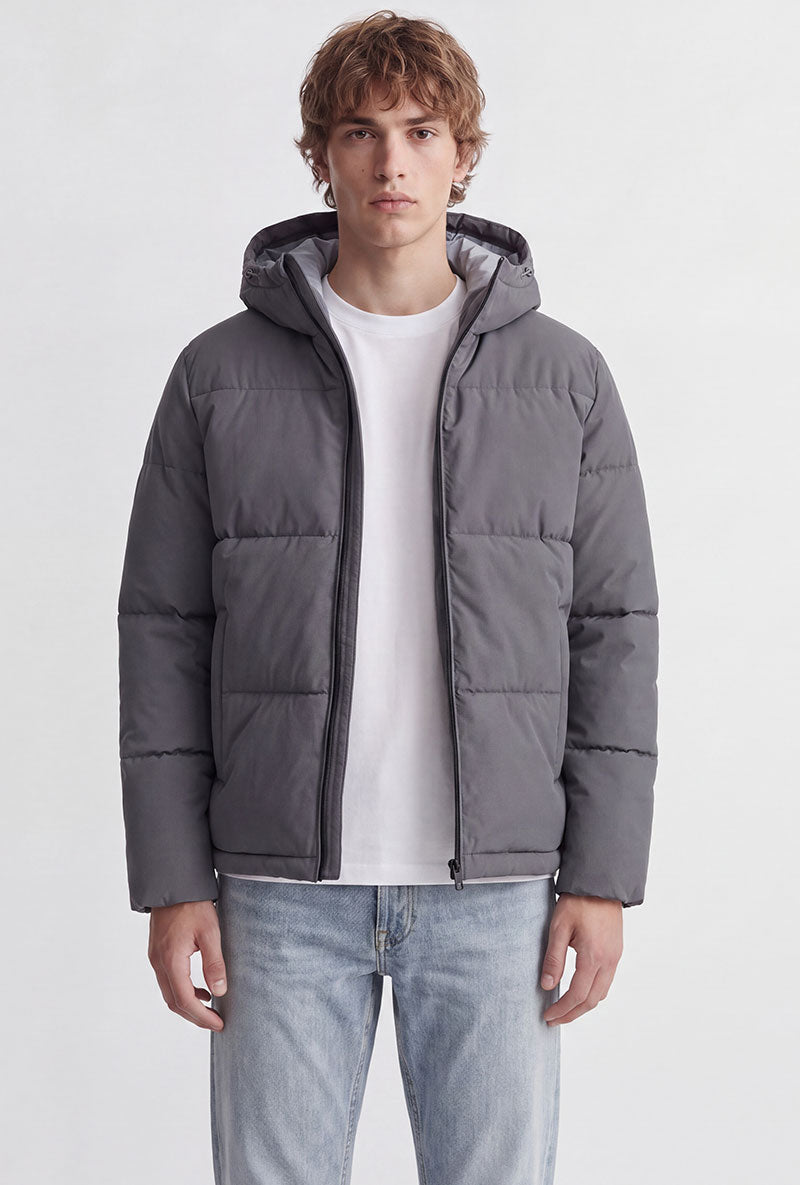 Front image of a model wearing Galaxy puffer jacket in charcoal, by brand Jack&jones
