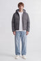 Front image of a model wearing the Galaxy puffer jacket in charcoal, by brand Jack&jones