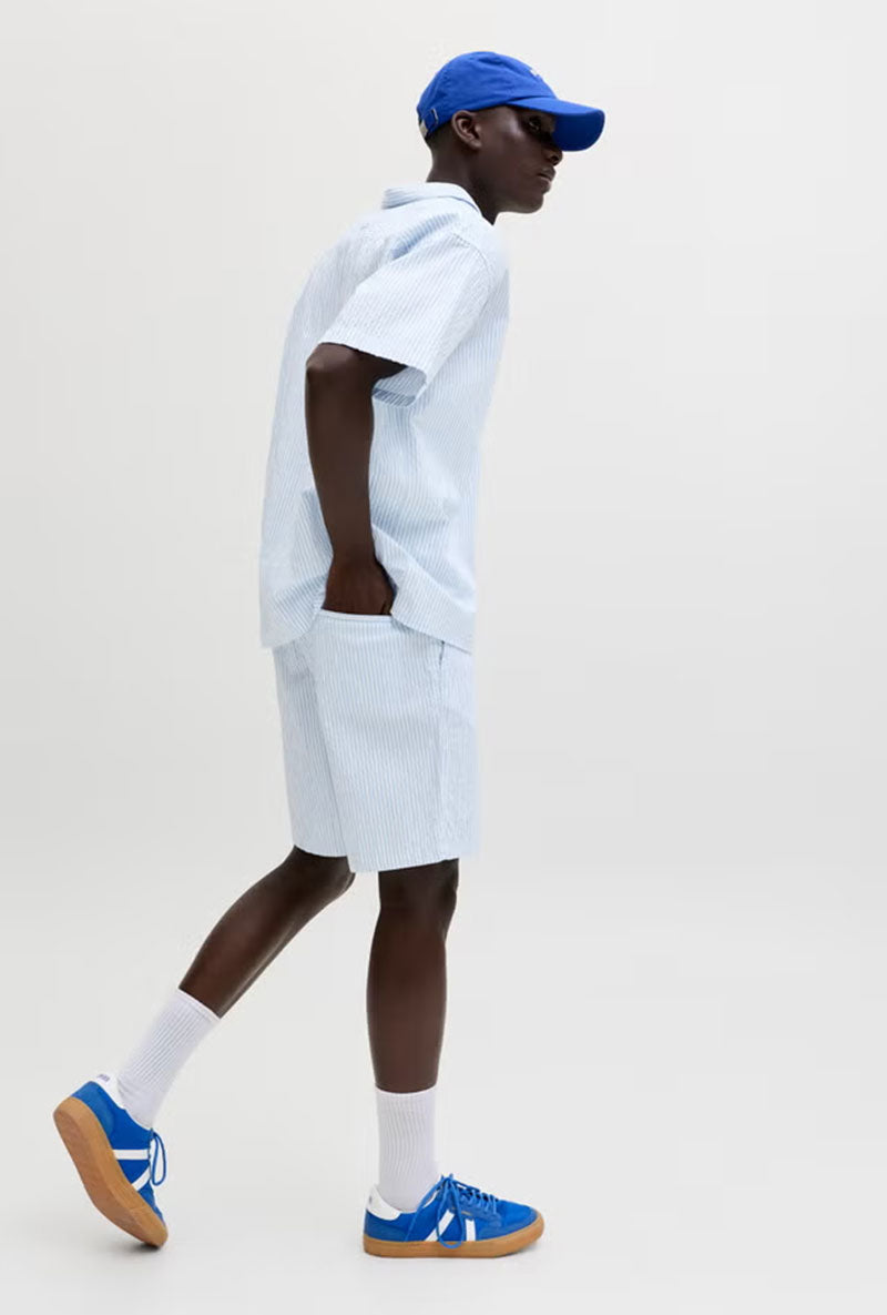 Front image of a model wearing Jaiden milo seersucker shorts in light blue, by brand Jack&jones