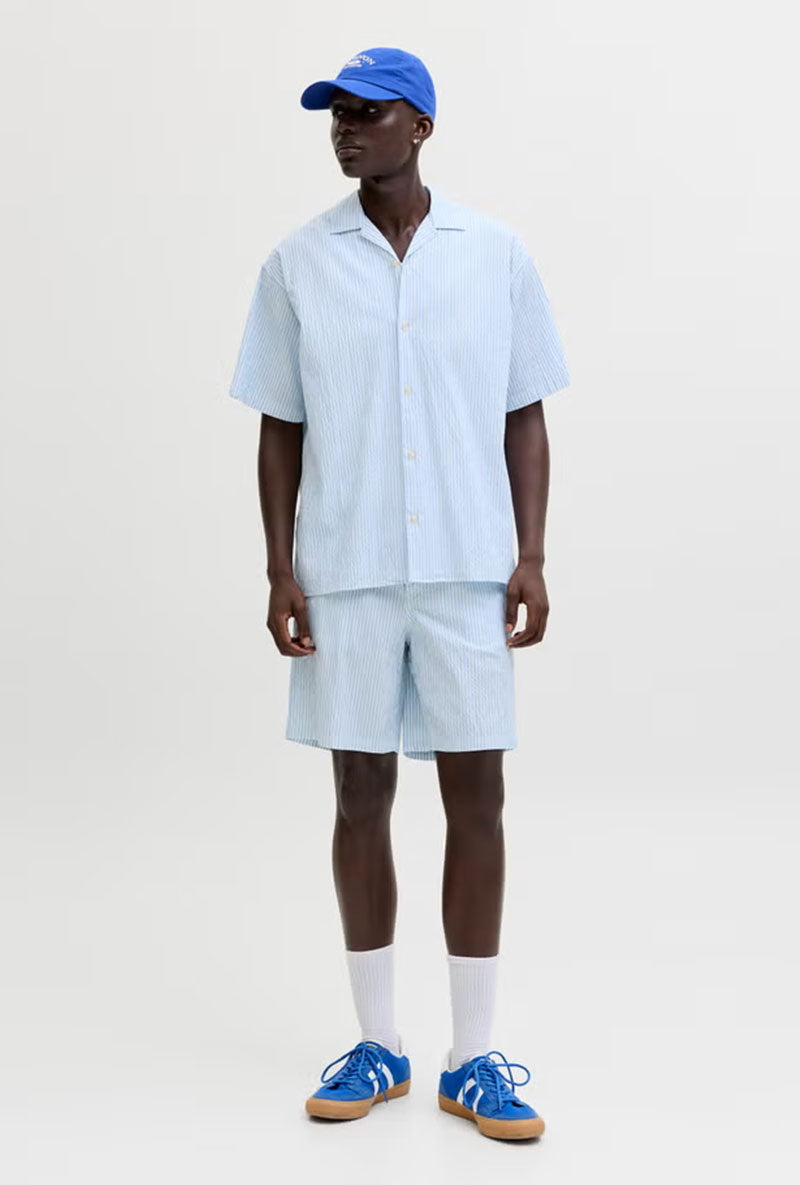 Front image of a model wearing Jaiden milo seersucker shorts in light blue, by brand Jack&jones