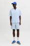 Front image of a model wearing the Jaiden milo seersucker shorts in light blue, by brand Jack&jones