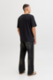 Back image of a model wearing the Jack and jones jeff logo tee in black, by brand Jack&jones