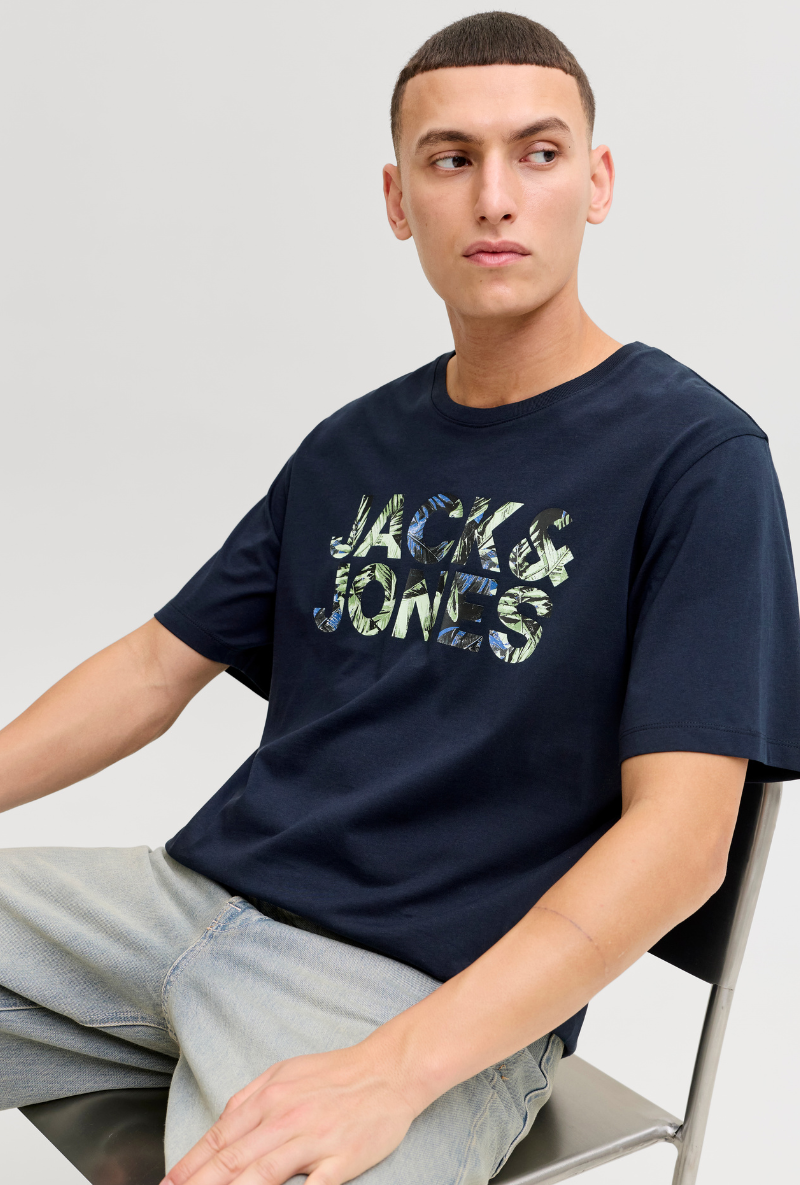 Front image of a model wearing Jack and jones jeff logo tee in navy, by brand Jack&jones