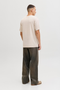 Back image of a model wearing the Jack and jones jeff logo tee in stone, by brand Jack&jones