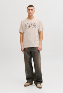 Front image of a model wearing the Jack and jones jeff logo tee in stone, by brand Jack&jones