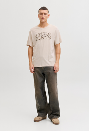 Front image of a model wearing the Jack and jones jeff logo tee in stone, by brand Jack&jones