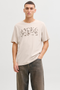 Front image of a model wearing the Jack and jones jeff logo tee in stone, by brand Jack&jones