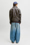 Back image of a model wearing the Marlon pu jacket in brown, by brand Jack&jones