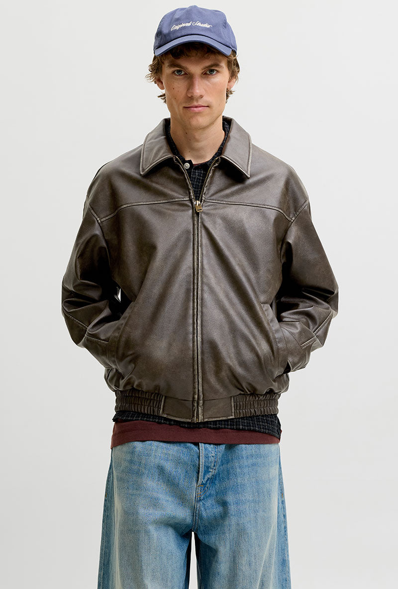 Front image of a model wearing Marlon pu jacket in brown, by brand Jack&jones