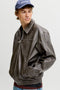 Front image of a model wearing the Marlon pu jacket in brown, by brand Jack&jones