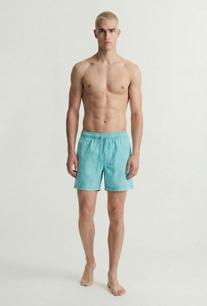 Front image of a model wearing Maui vibrant wash swimshorts in blue, by brand Jack&jones