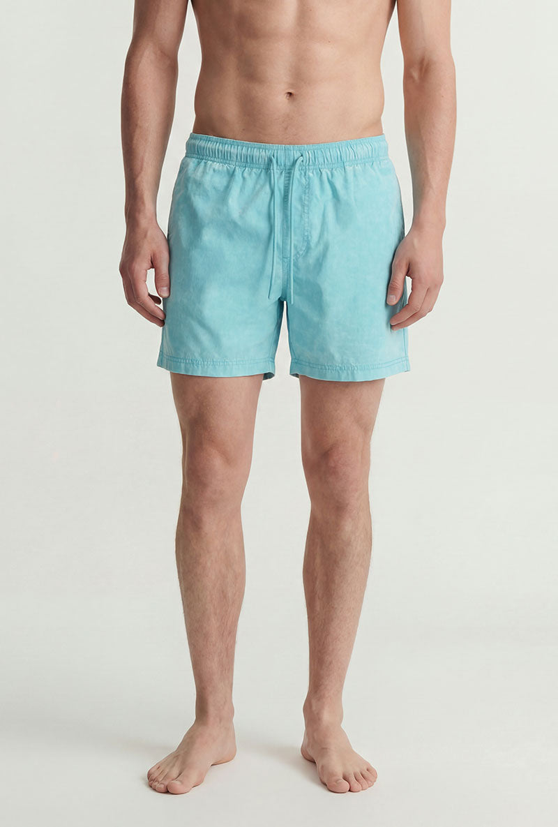 Front image of a model wearing Maui vibrant wash swimshorts in blue, by brand Jack&jones