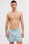 Front image of a model wearing the Jack and jones milano woven 3 pk trunks in light blue, by brand Jack&jones