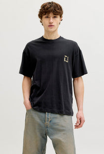 Front image of a model wearing the Montauk back graphic tee in black, by brand Jack&jones