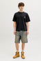 Front image of a model wearing the Montauk back graphic tee in black, by brand Jack&jones
