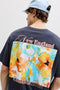Back image of a model wearing the Montauk back graphic tee in charcoal, by brand Jack&jones