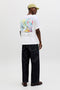 Back image of a model wearing the Montauk back graphic tee in white, by brand Jack&jones