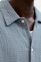 Front detail image of a model wearing the Nantucket double cloth ss shirt in blue, by brand Jack&jones