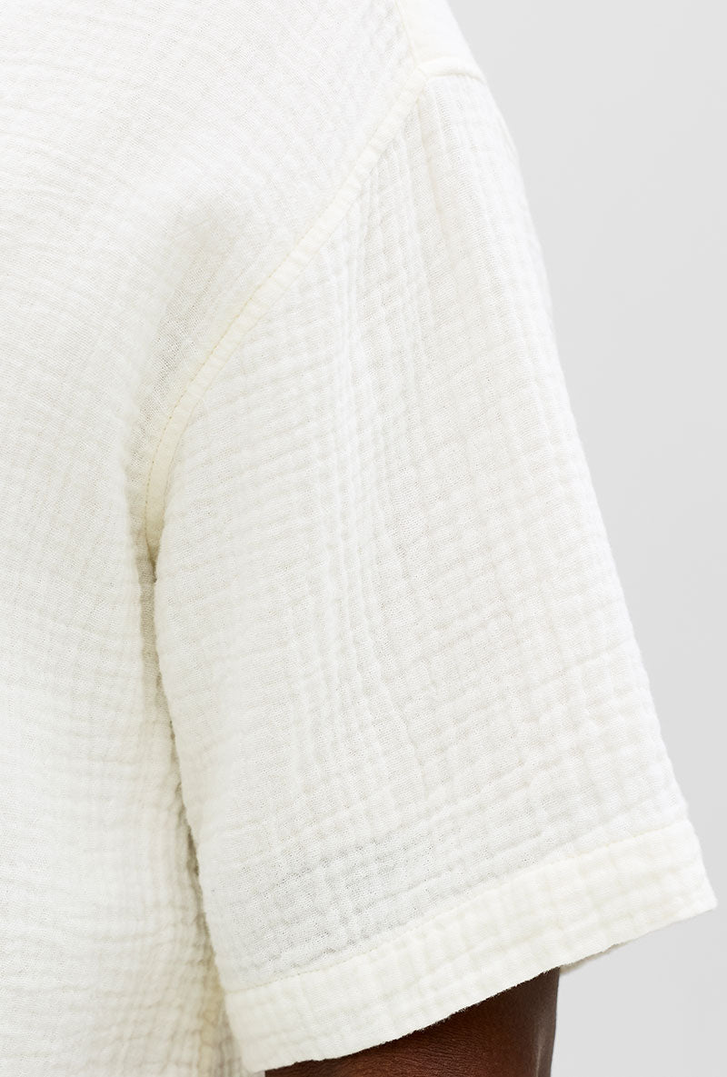 Front detail image of a model wearing Nantucket double cloth ss shirt in off white, by brand Jack&jones