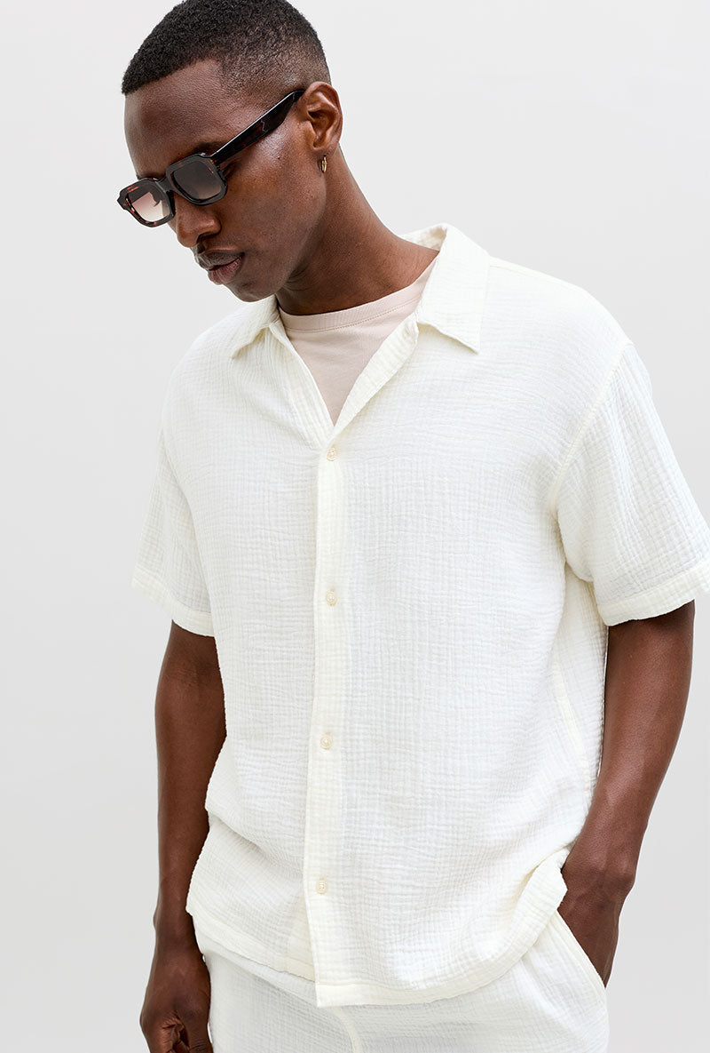 Front image of a model wearing Nantucket double cloth ss shirt in off white, by brand Jack&jones