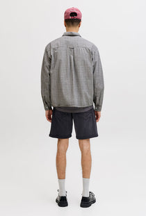 Back image of a model wearing the Rick jj fox denim shorts in black, by brand Jack&jones