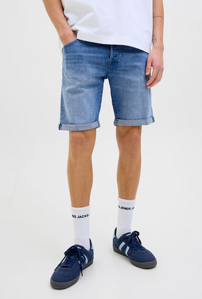 Front image of a model wearing Rick jj fox denim shorts in light denim, by brand Jack&jones