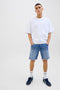 Front image of a model wearing the Rick jj fox denim shorts in light denim, by brand Jack&jones