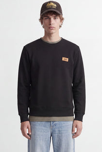 Front image of a model wearing the Rush sweat crew neck sweatshirt in black, by brand Jack&jones