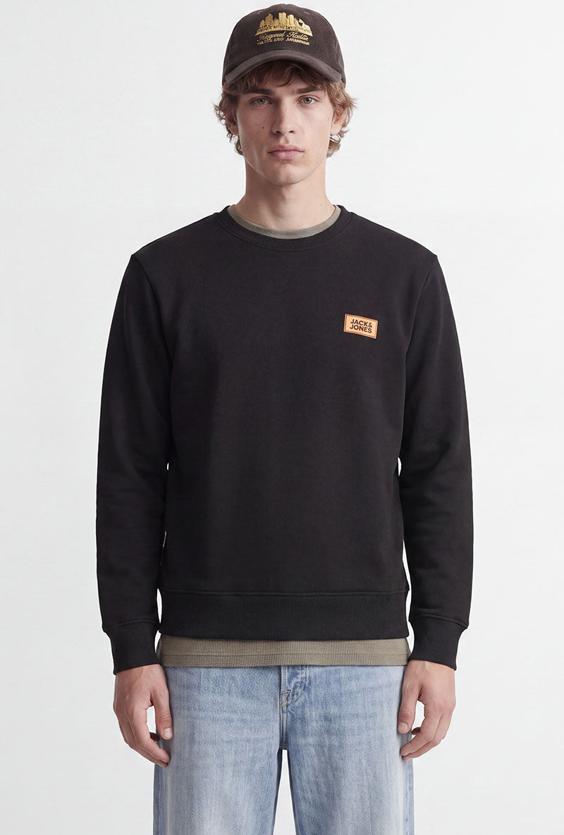 Front image of a model wearing Rush sweat crew neck sweatshirt in black, by brand Jack&jones