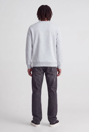 Back image of a model wearing the Rush sweat crew neck sweatshirt in light grey, by brand Jack&jones