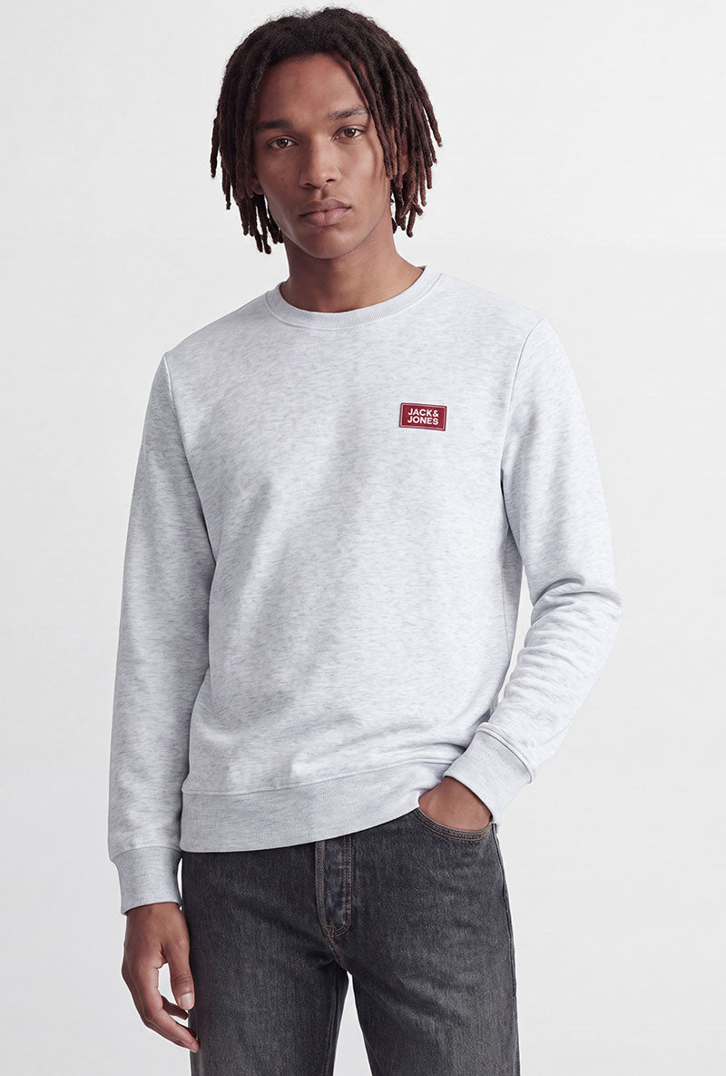 Front image of a model wearing Rush sweat crew neck sweatshirt in light grey, by brand Jack&jones