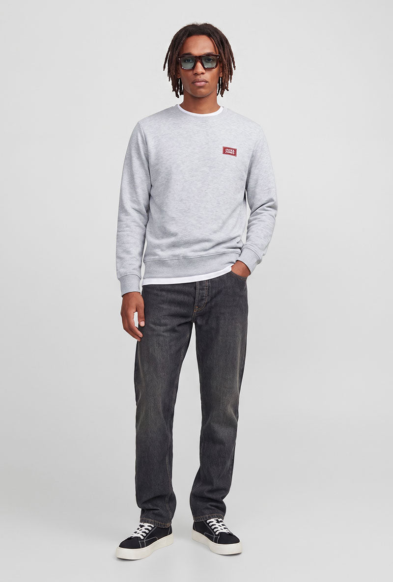 Front image of a model wearing Rush sweat crew neck sweatshirt in light grey, by brand Jack&jones