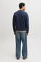 Back image of a model wearing the Rush sweat crew neck sweatshirt in navy, by brand Jack&jones
