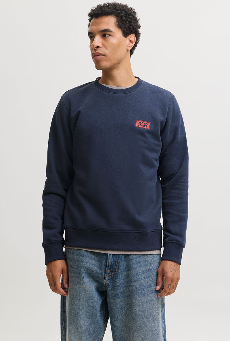 Front image of a model wearing Rush sweat crew neck sweatshirt in navy, by brand Jack&jones