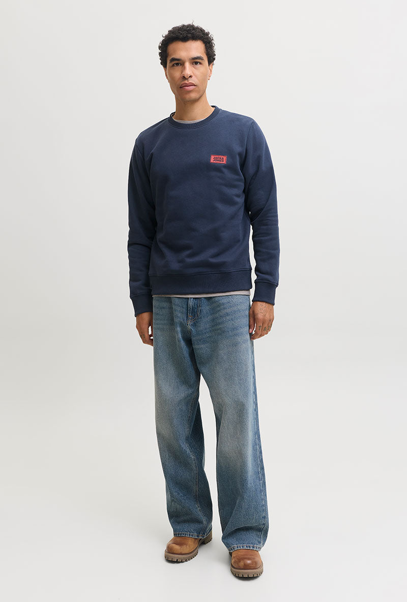 Front image of a model wearing Rush sweat crew neck sweatshirt in navy, by brand Jack&jones