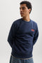 Front image of a model wearing the Rush sweat crew neck sweatshirt in navy, by brand Jack&jones